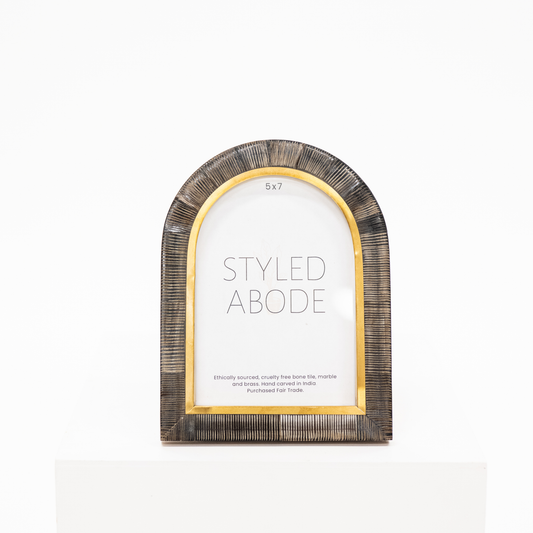 5x7 arch picture frame with carved ridges in a dark horn