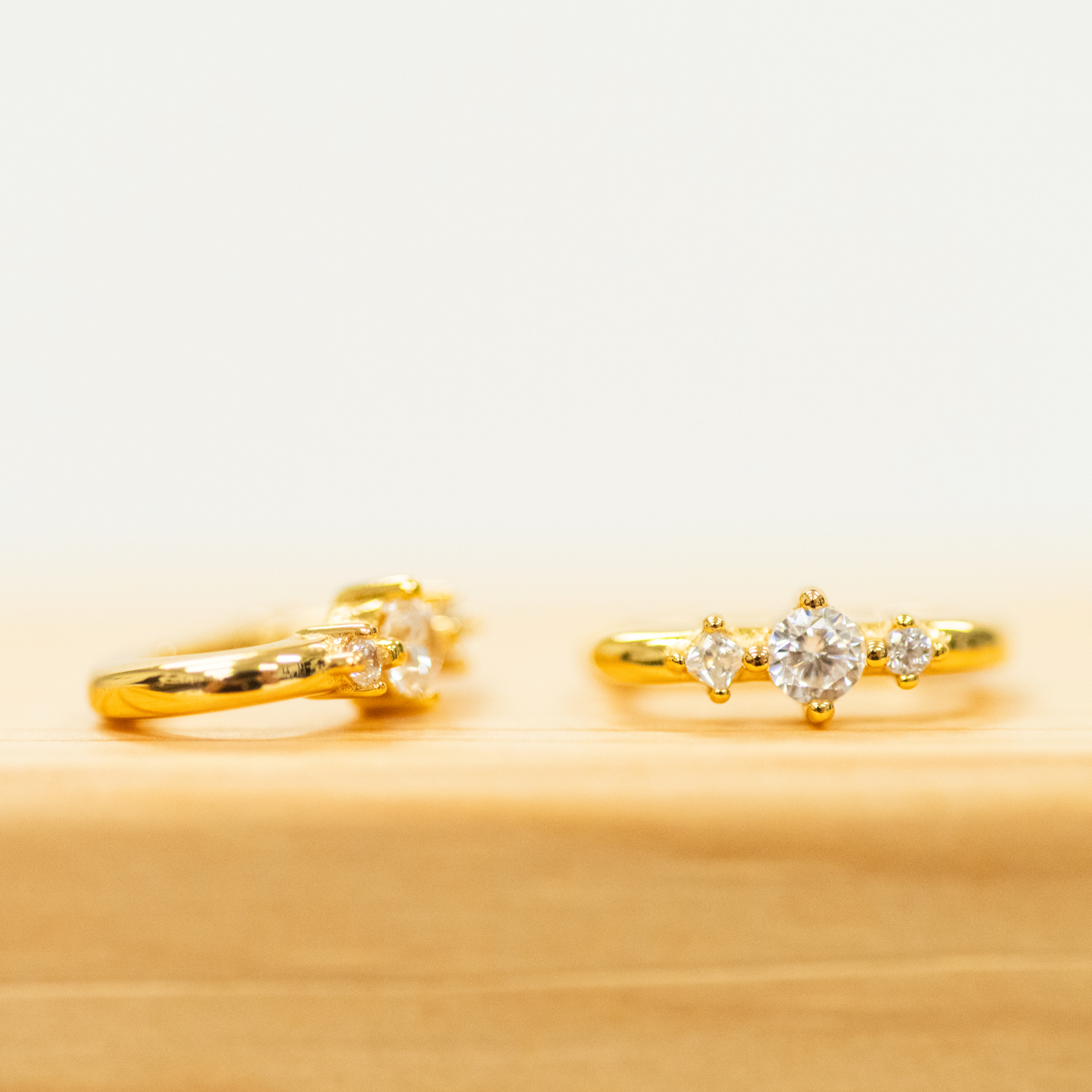 Square Triple CZ Huggies with a slim hoop earring in gold