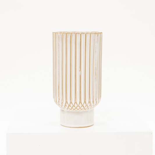 white ceramic vase with a ribbed style
