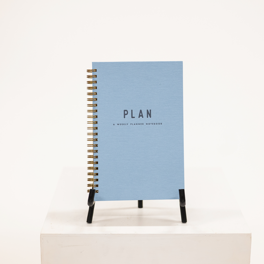 blue hardcover planner with notebook
