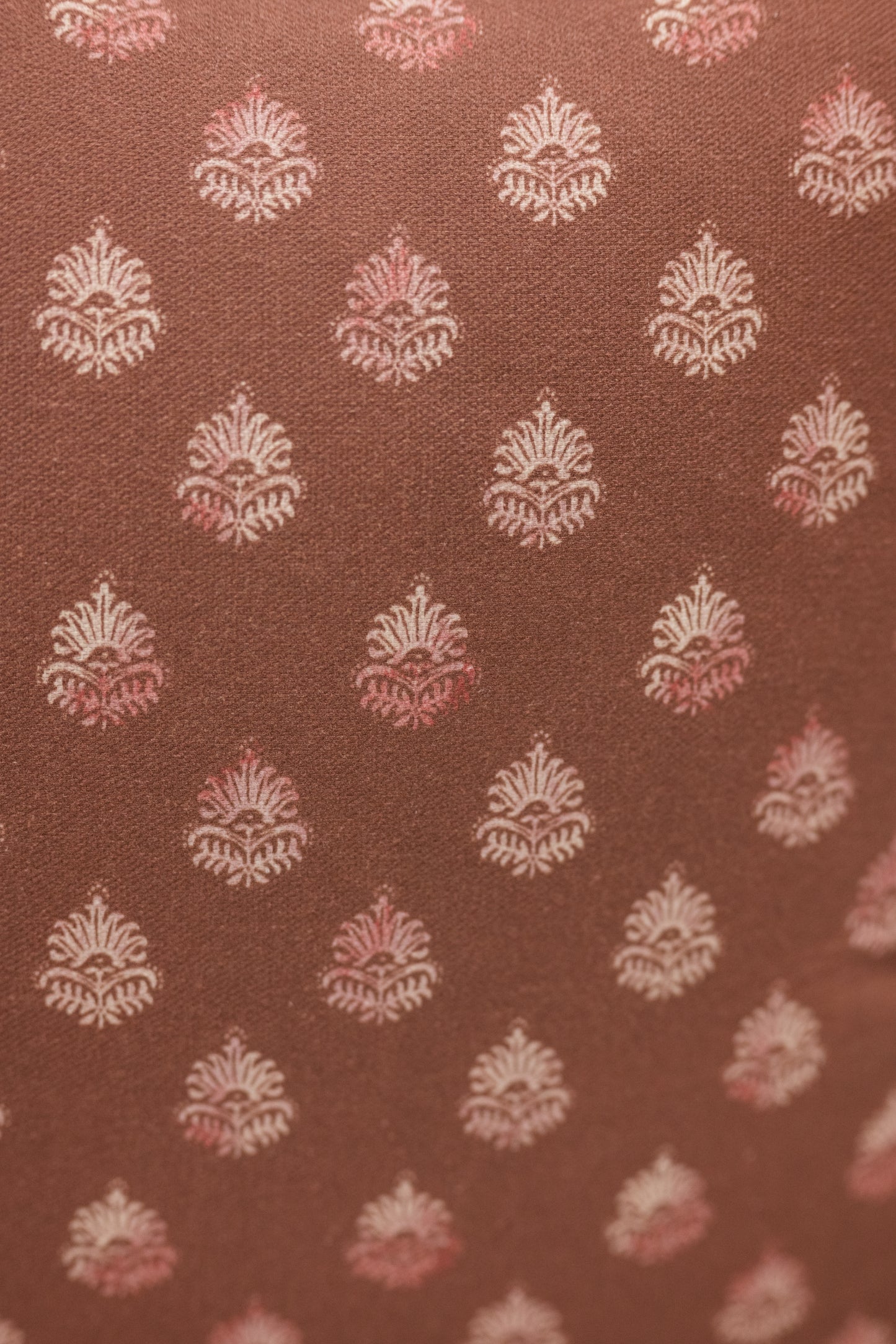 Brown fabric with white and pink floral pattern