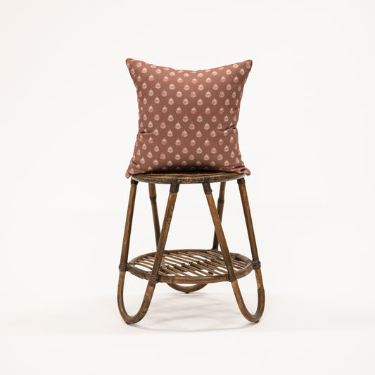 clay colored square pillow with block print pattern