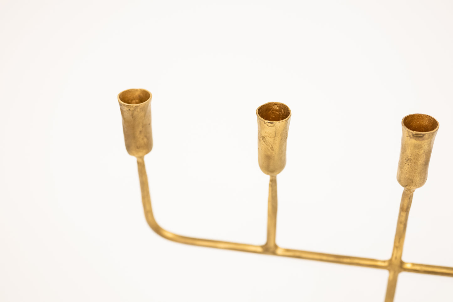 golden candelabra with five linear arms