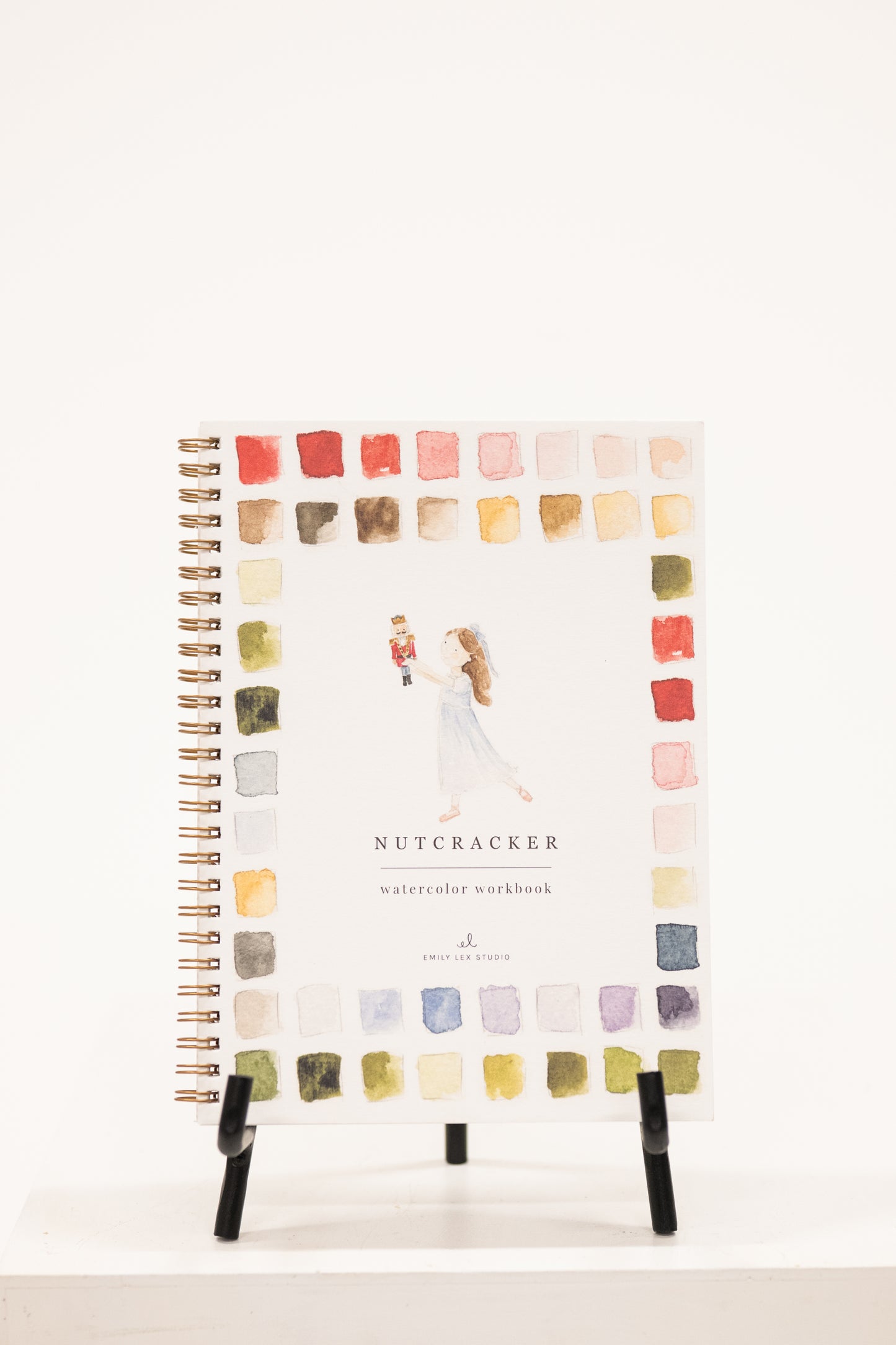 a watercolor workbook activity book with scenes from the nutcracker