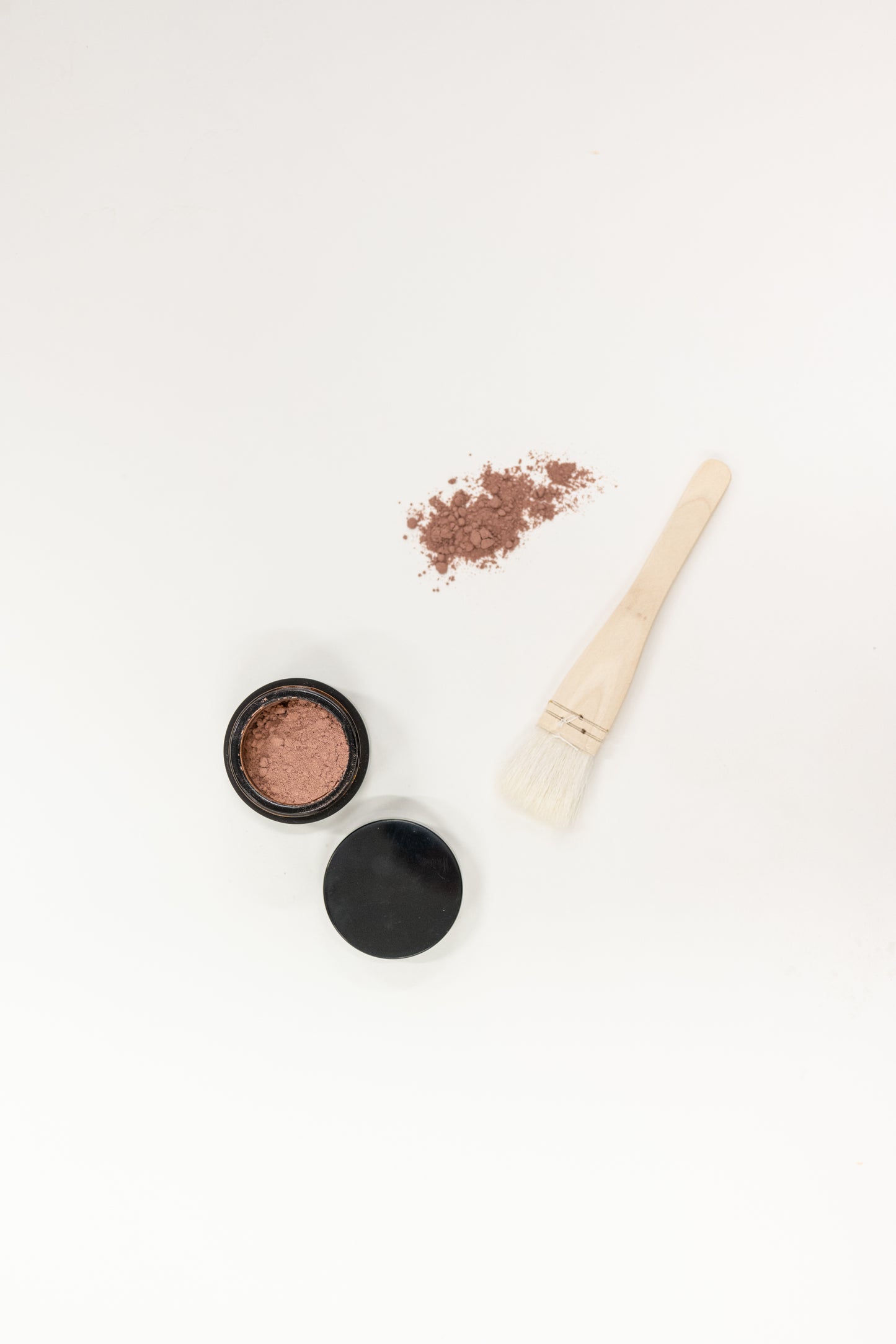 powdered face mask mix and natural face mask brush