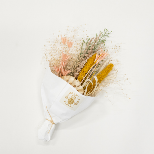 dried flower bouquet of pinks, yellows and creams