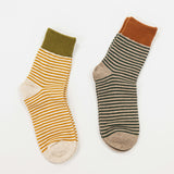 casual socks made with a cotton mix, featuring stripes and a different tone top