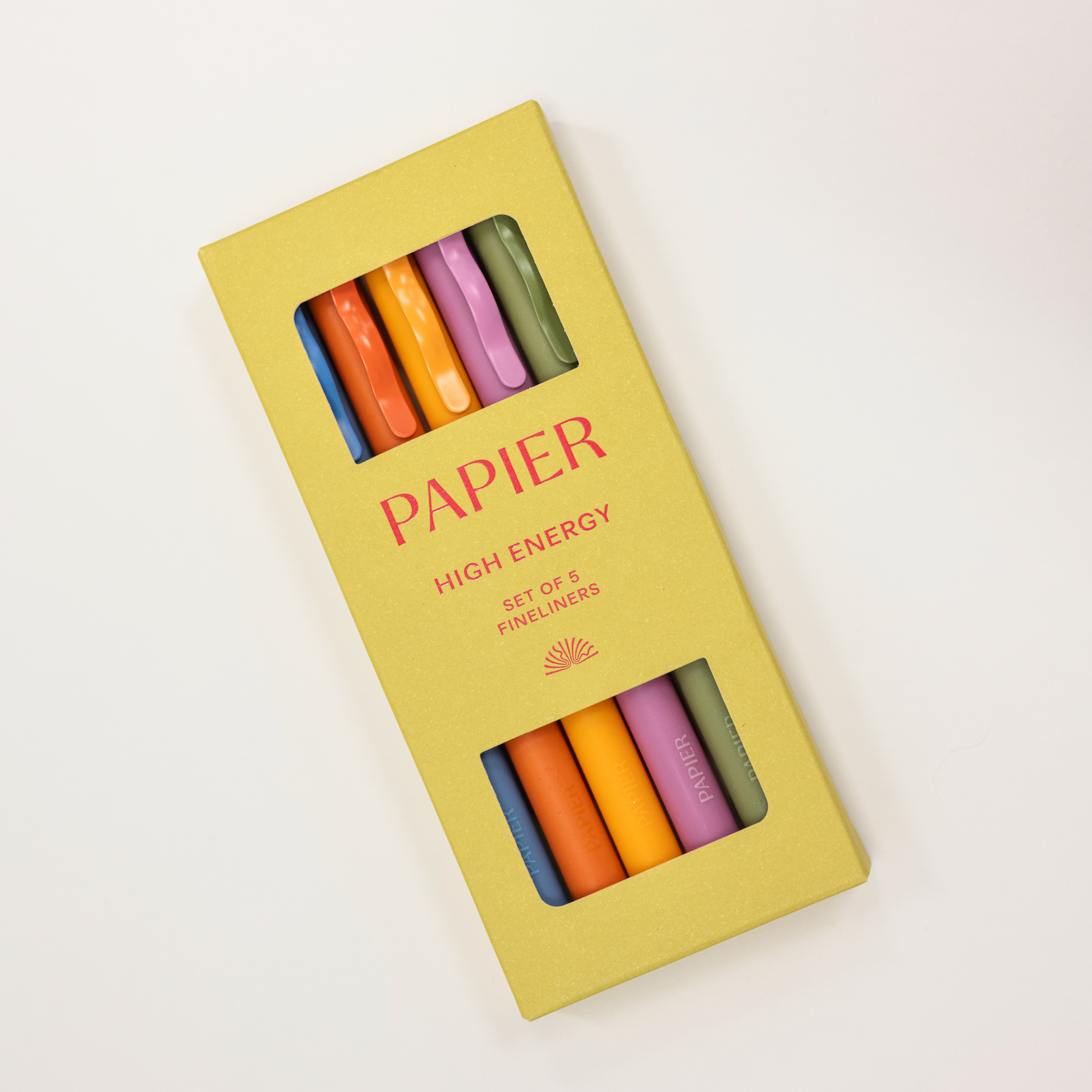 Set of colorful fineliners in a 'PAPIER' branded box on a white background