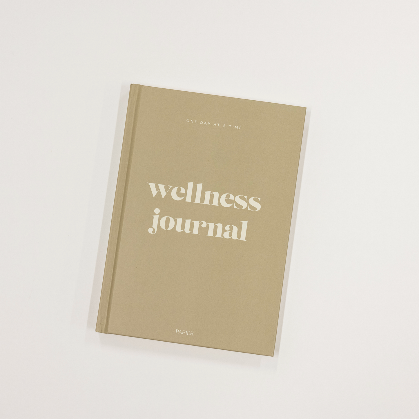 Beige wellness journal on a white background