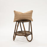 Beige Striped Woven Lumbar Pillow 12x20" on a wicker stool