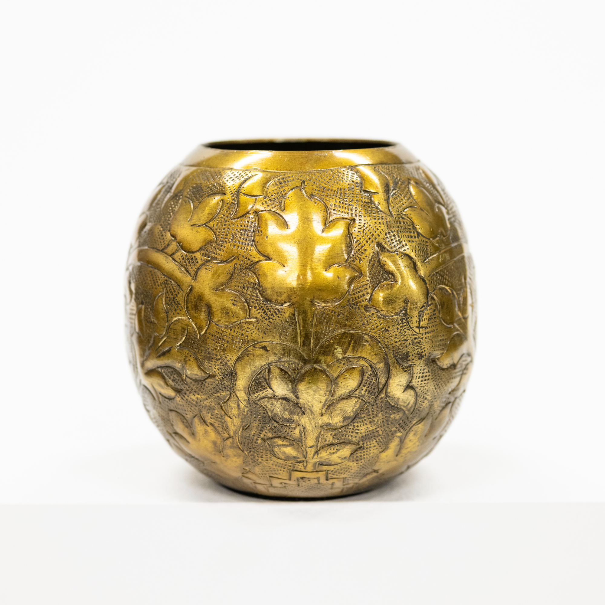 Rustic and antique version of a bronzed vase with an embossed design.