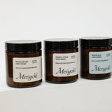 Three jars of Merigold hand cream on a white background