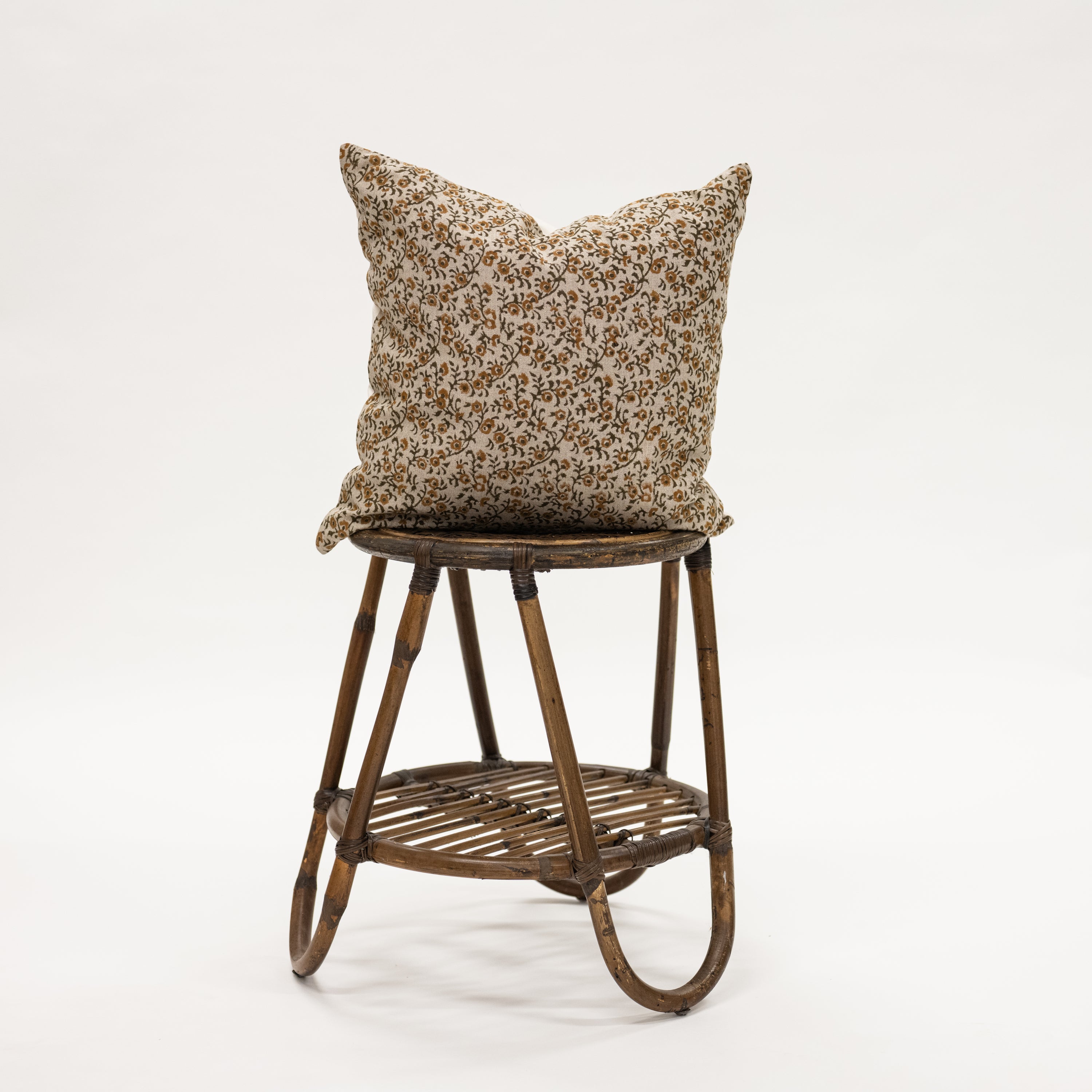 Fall Print Mustard Mini Floral Print Pillow - 20x20 inch size pillow on wicker stand