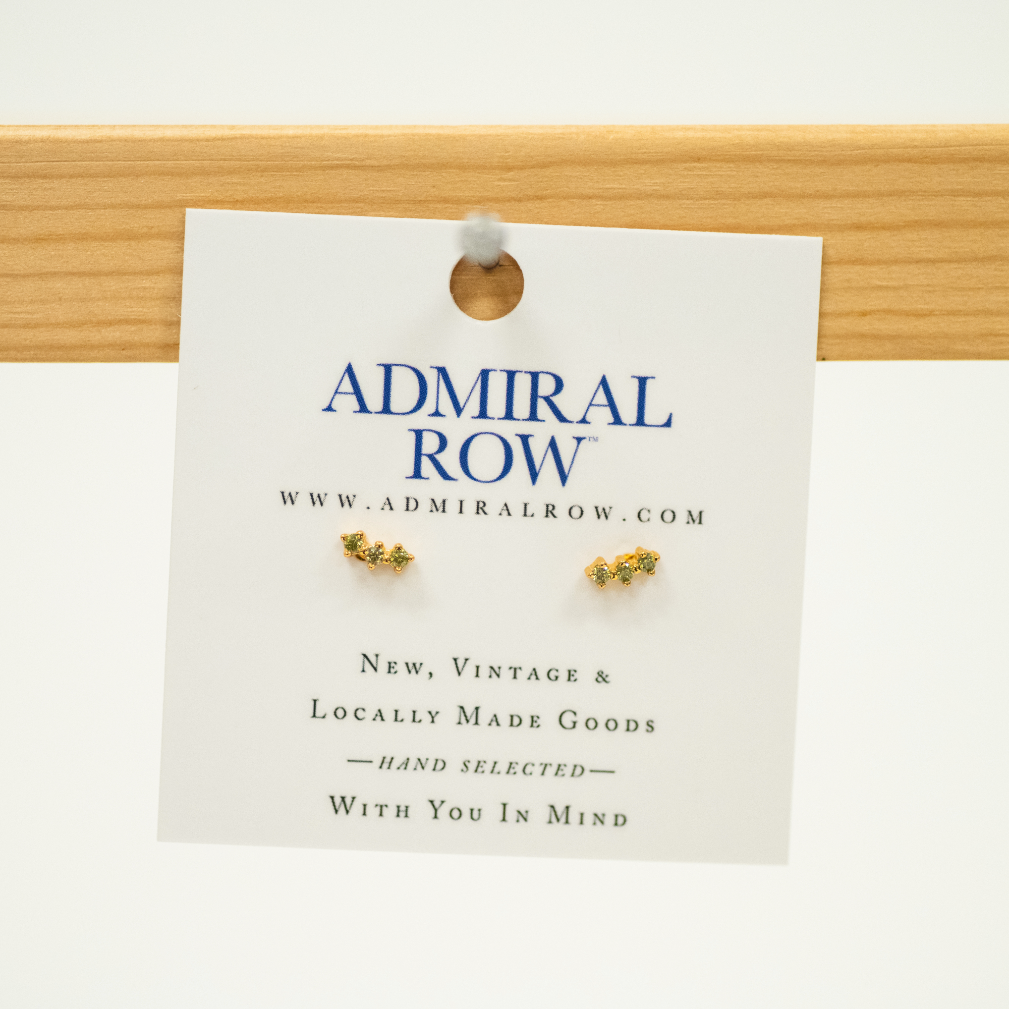 Olive Green Stud Earrings with three gems for a slight curve stud earring set in gold