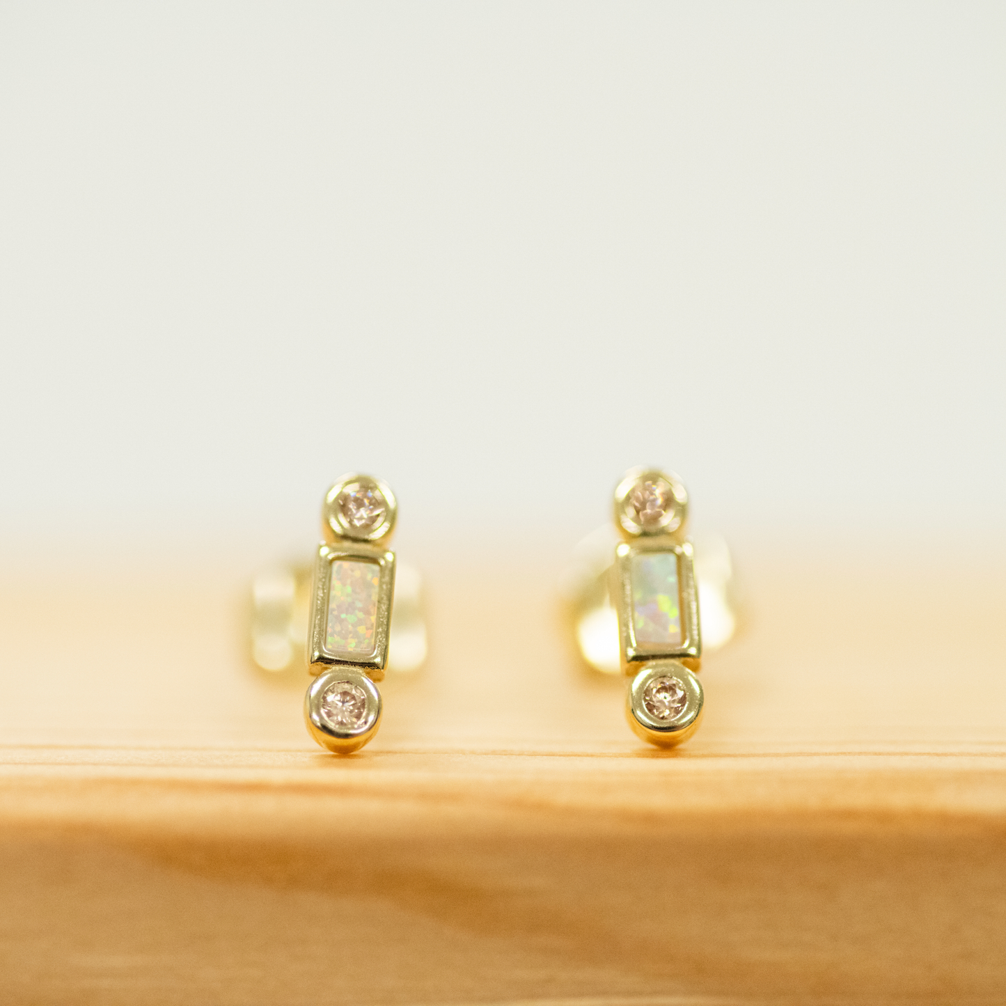 Opal Bar Stud Earring with bar shaped opal and two CZ stones set in gold