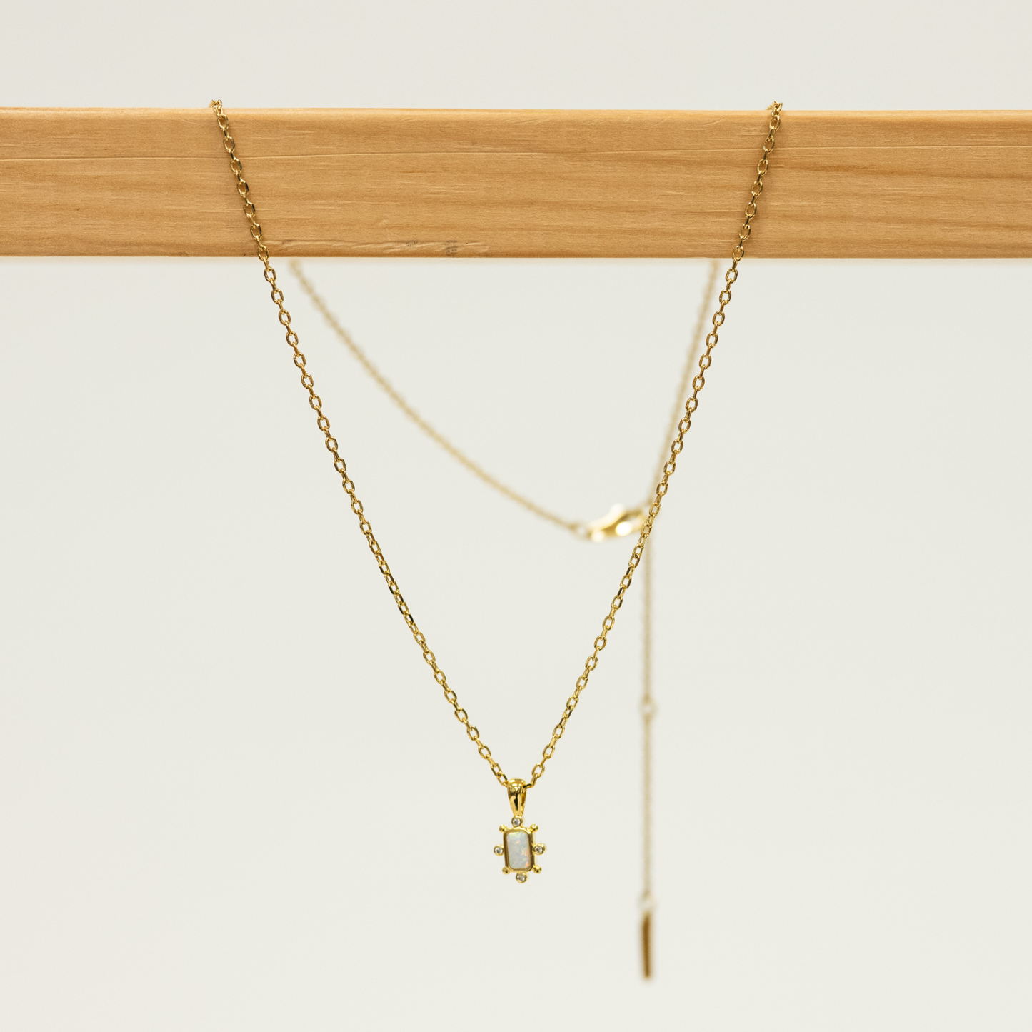 Opal Bar Shaped Pendant with Mini CZ studs on a gold Necklace