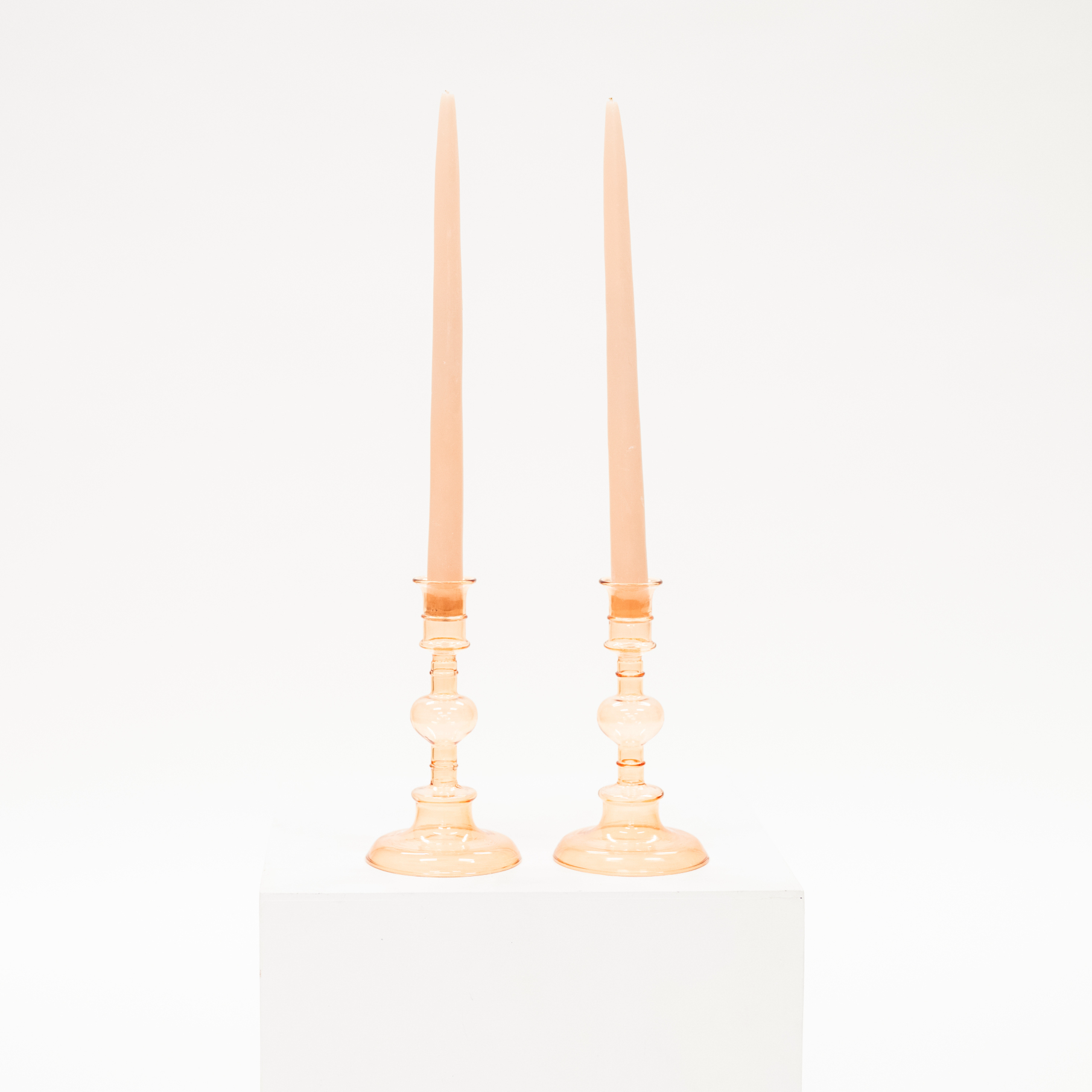 Pink glass candlestick taper holder