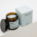 Jar of Merigold hand cream with a matching box on a white surface