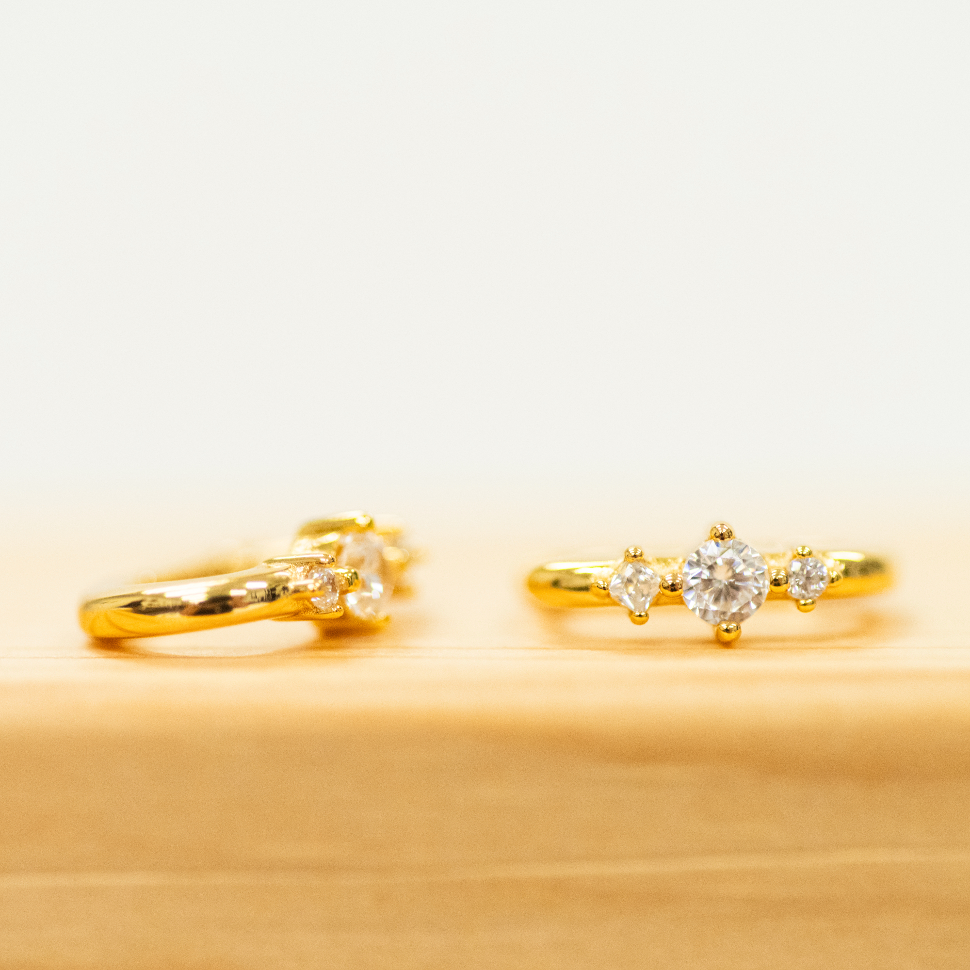 Square Triple CZ Huggies with a slim hoop earring in gold