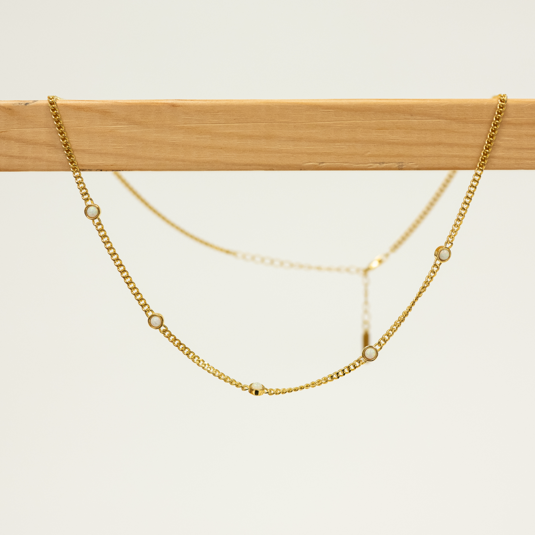 White Opal Necklace 18k Gold Plated On Wooden Hanger and White Background