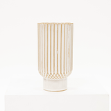 white ceramic vase with a ribbed style