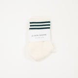cream white shorter crew girlfriend sock with dark hunter green stripes.