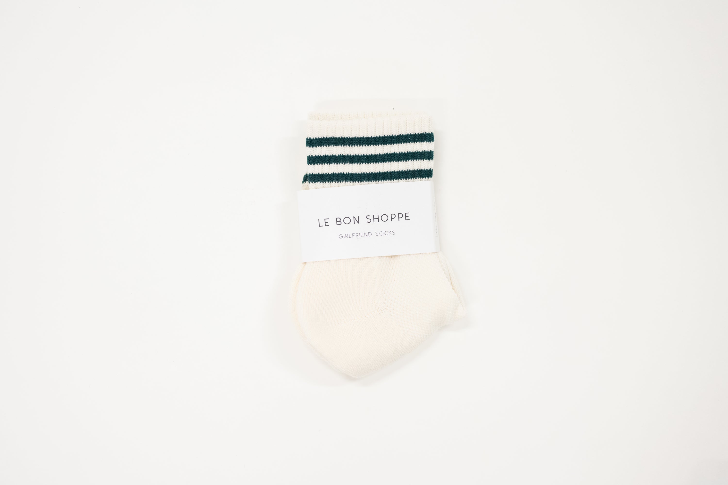 cream white shorter crew girlfriend sock with dark hunter green stripes.