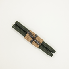 dark green candle taper with fluted pattern