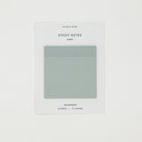 Pack of blue green sticky notes with brand name on a white background