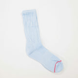 A light blue ribbed crew sock with a thin pink stripe near the toe, displayed on a clean white background.