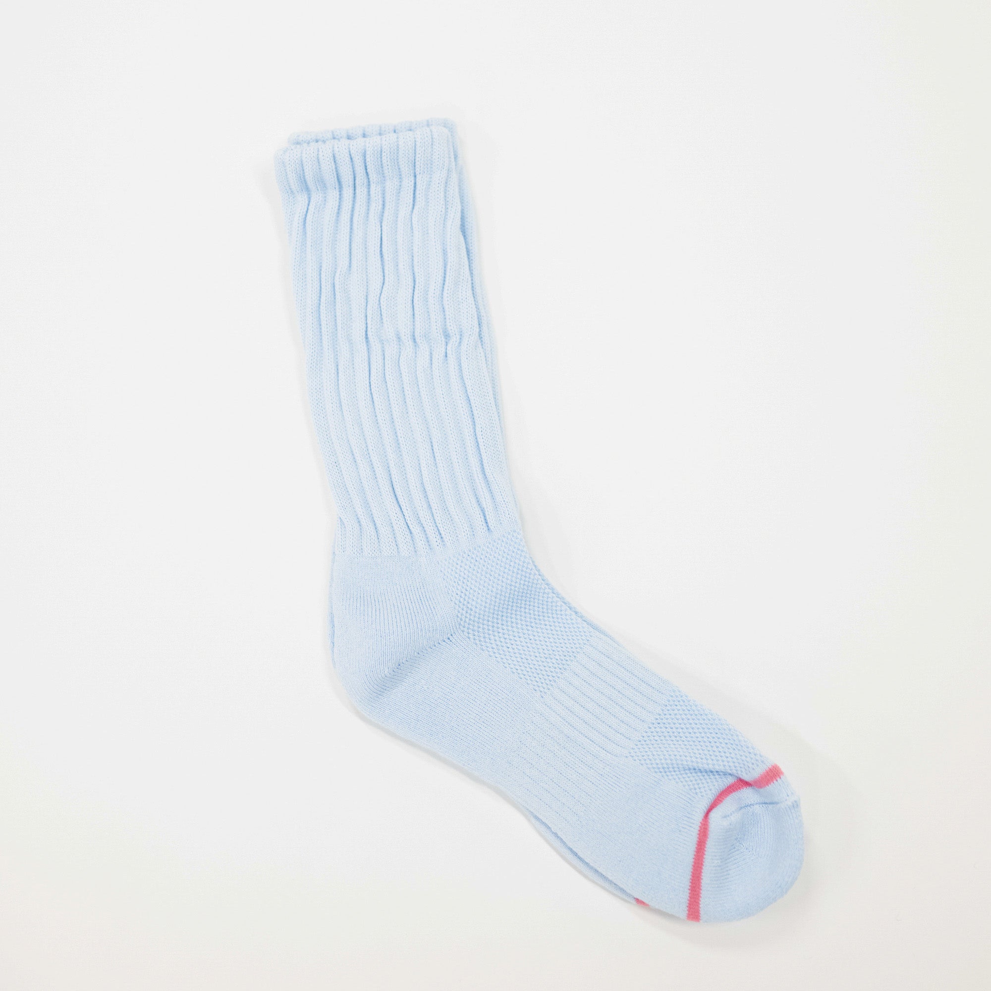 A light blue ribbed crew sock with a thin pink stripe near the toe, displayed on a clean white background.