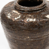 close up view of vintage bean pot with glossy finish