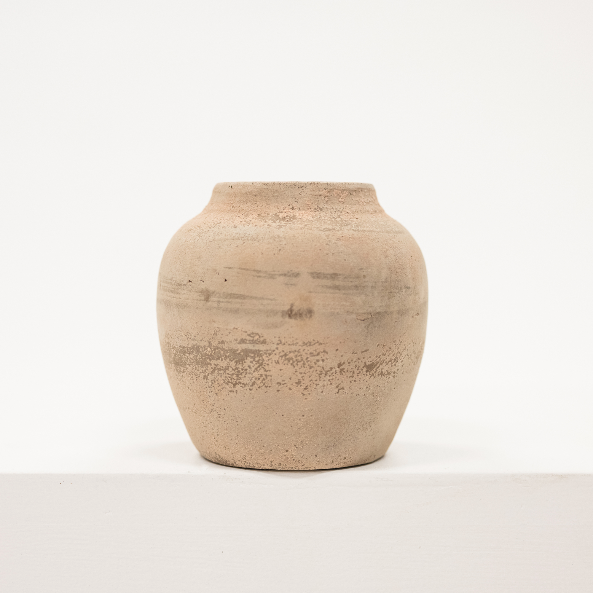 small vase with a beige chalky finish
