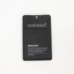 Noshinku Bergamot hand sanitizer in a black rectangular refillable bottle with white text, shown on a plain white background.
