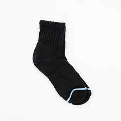 A single black ribbed ankle sock with a light blue accent line along the toe, displayed on a clean white background.