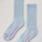 Light blue socks with pink text on a light gray background