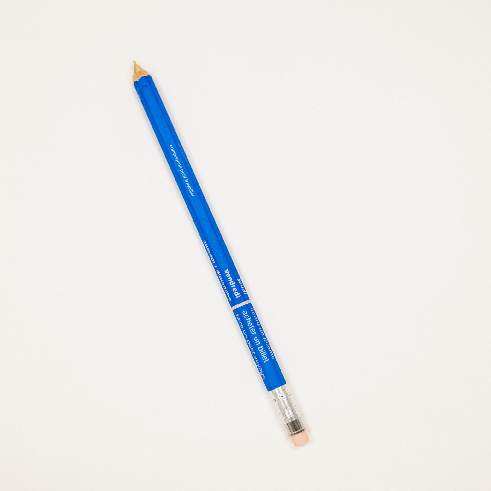 Blue colored pencil on a white background