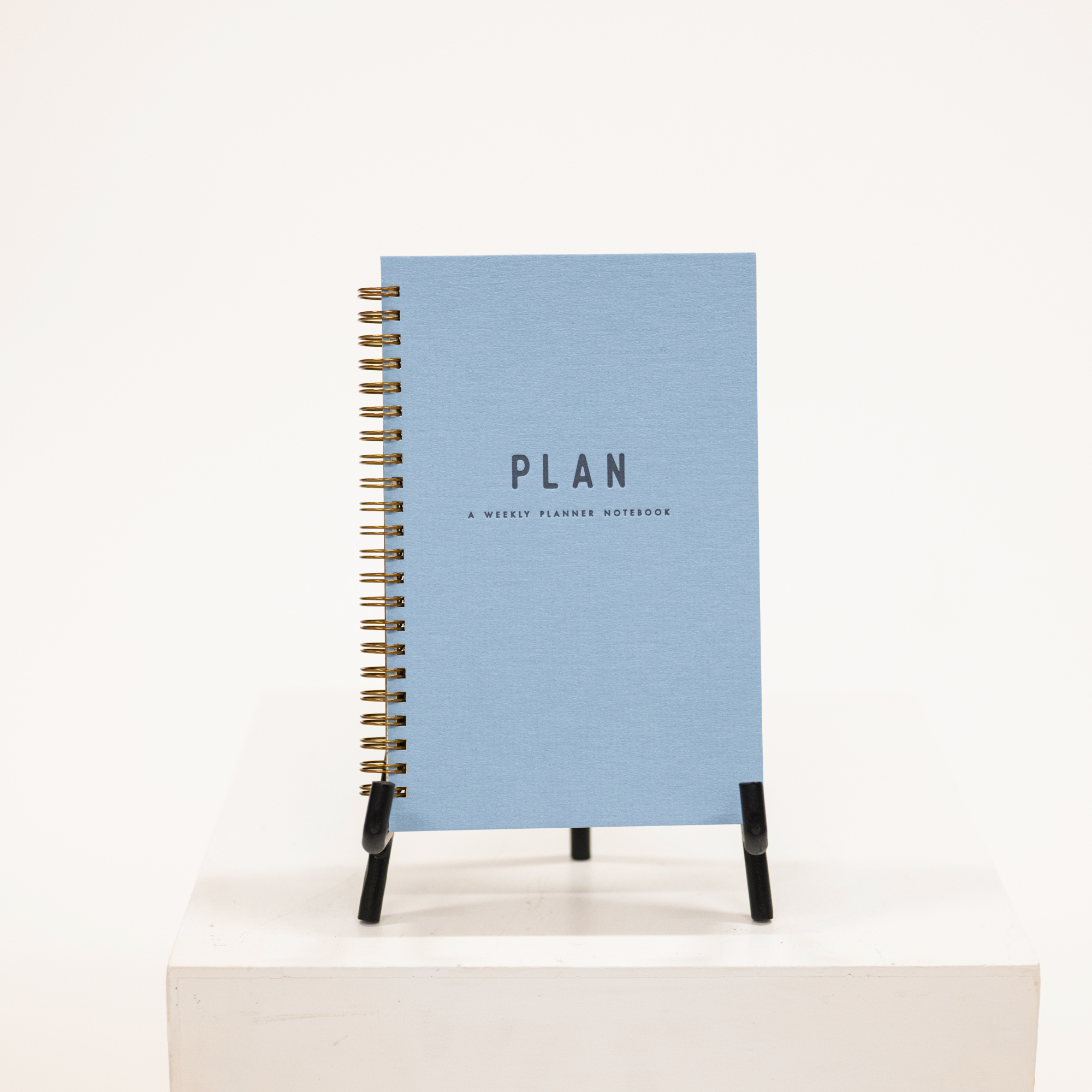 blue hardcover planner with notebook