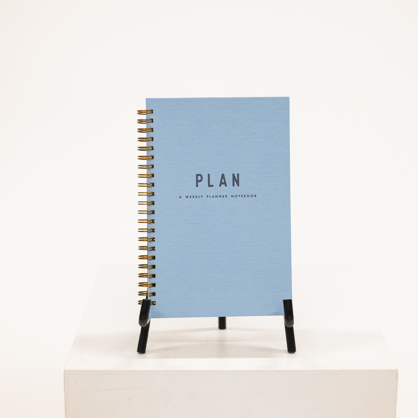 blue hardcover planner with notebook