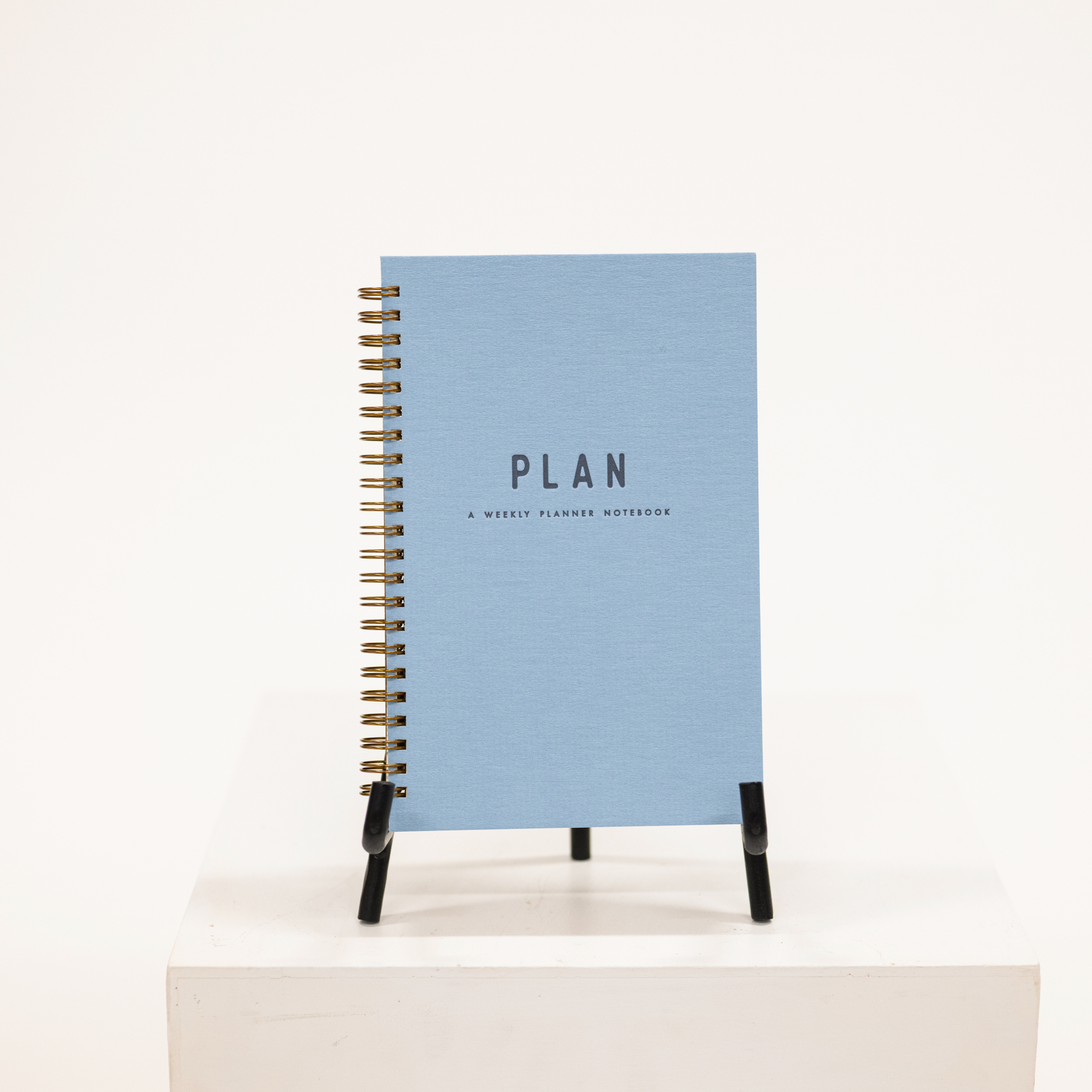 blue hardcover planner with notebook