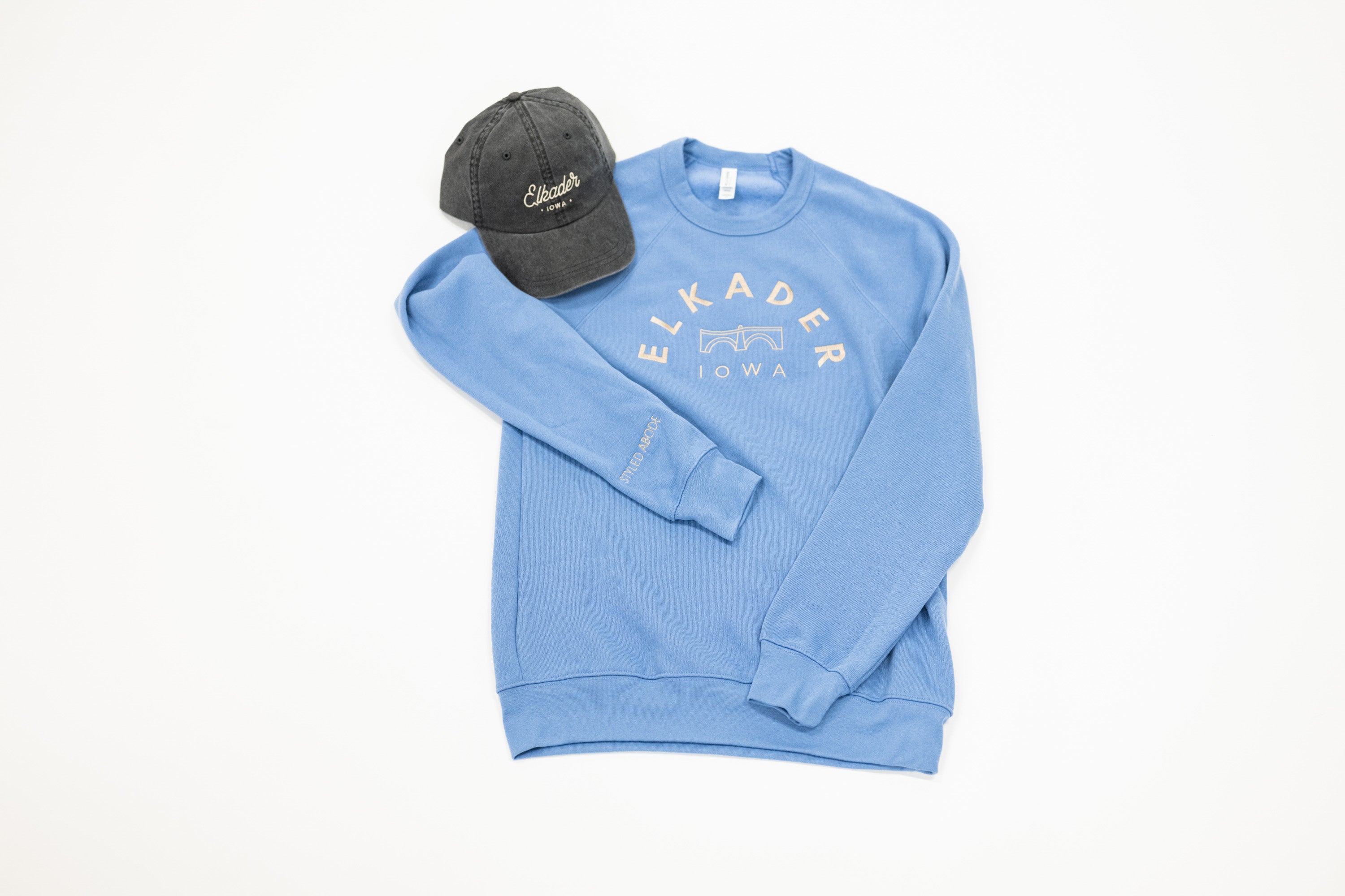 Elkader logo dad hat and blue purple crew sweatshirt