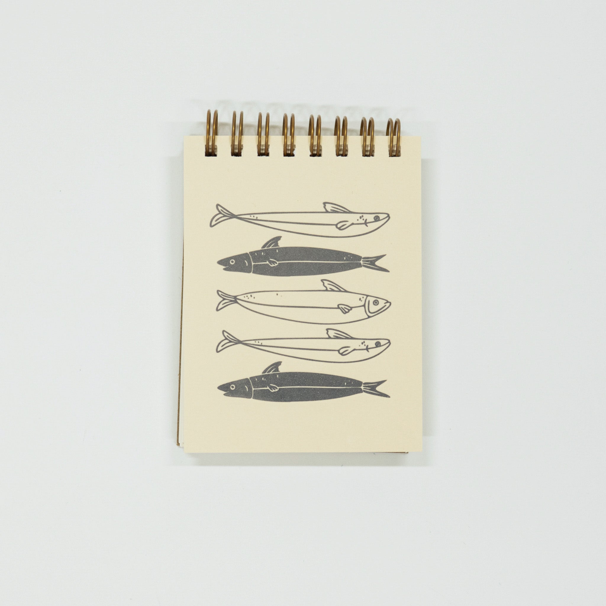 Notebook with fish illustrations on a white background