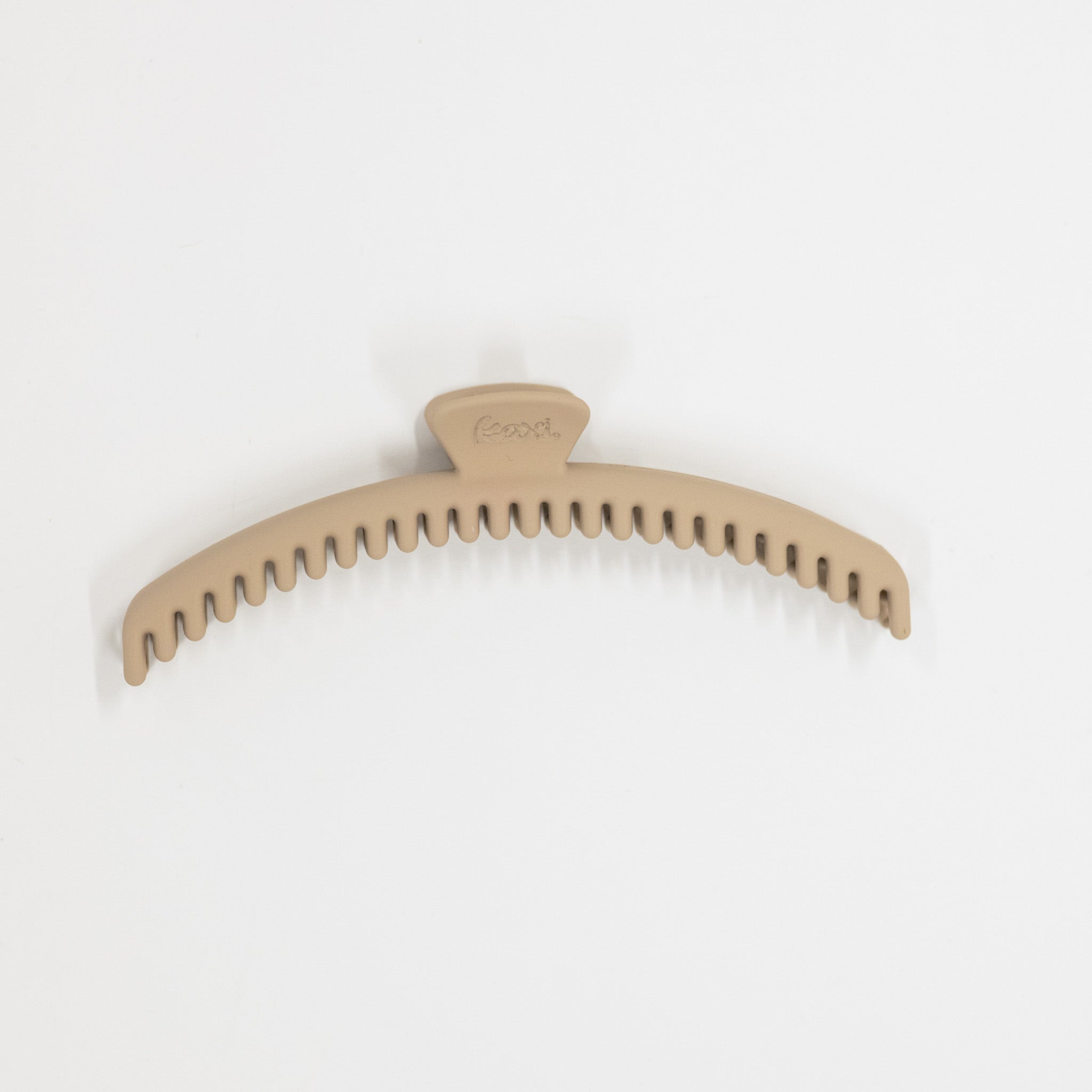 Beige hair clip on a white background