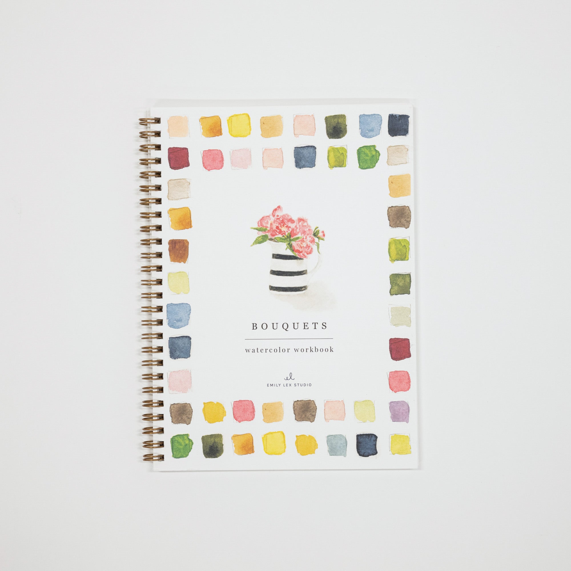 A spiral-bound watercolor workbook titled 'BOUQUETS' with a floral illustration on the cover, surrounded by a border of colorful paint swatches, shown on a light gray background.