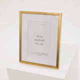 brass metal frame with a white mat