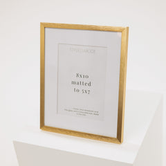 brass metal frame with a white mat