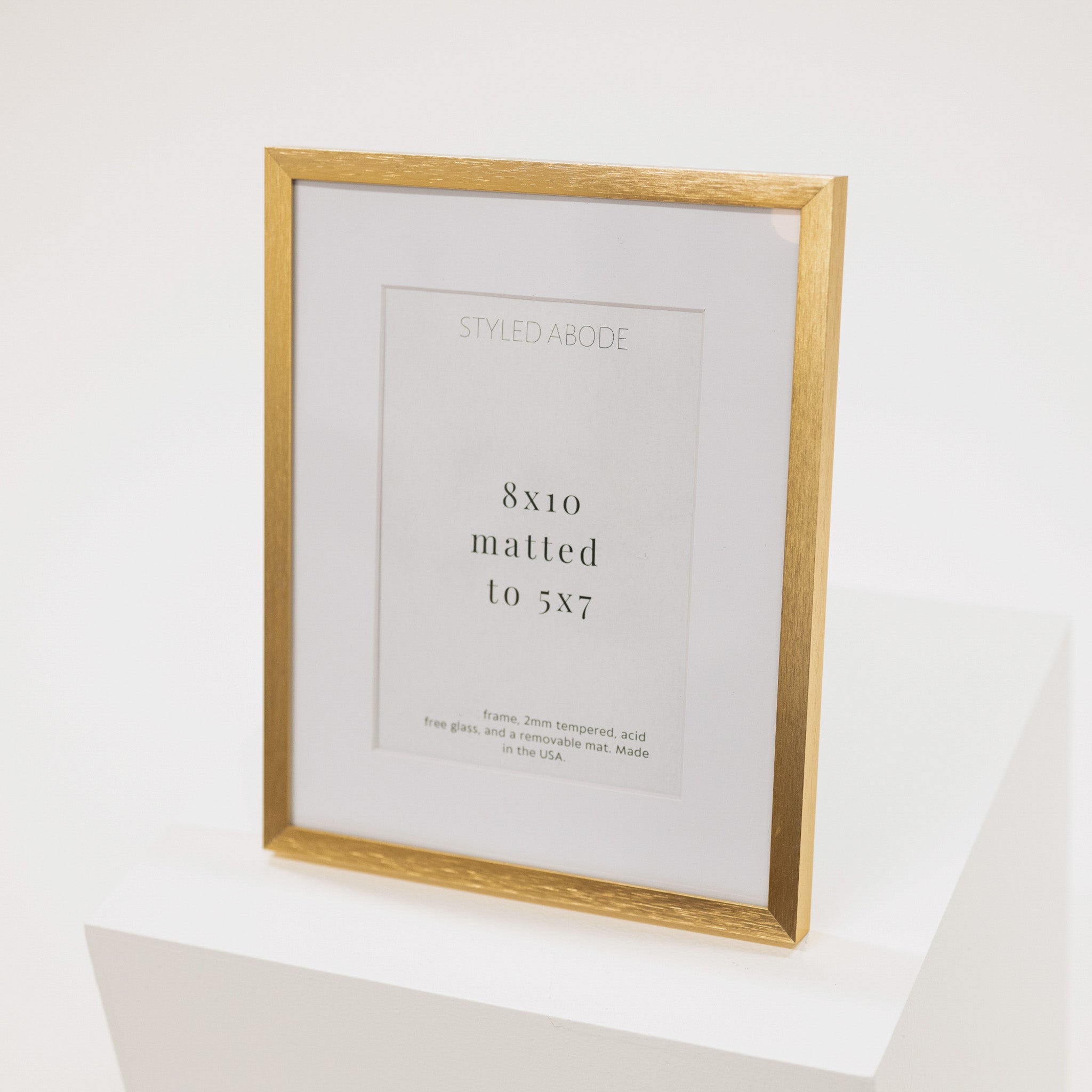 brass metal frame with a white mat