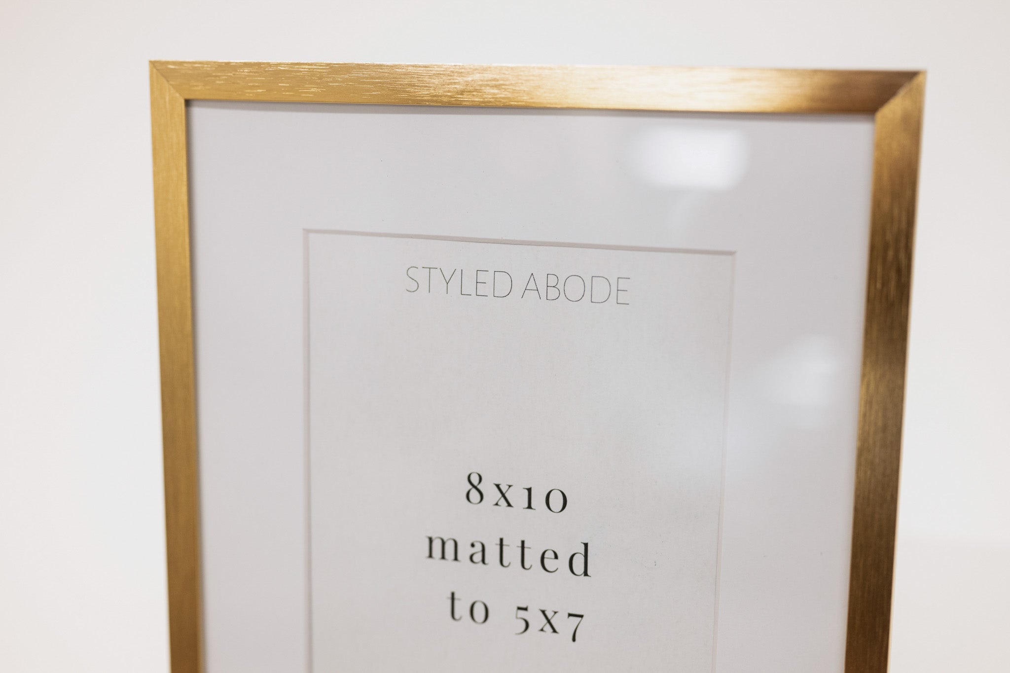 brass metal frame and white mat in size 8x10
