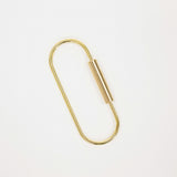 A minimalist gold metal keychain ring shown on a clean white background.