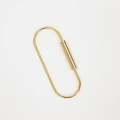 A minimalist gold metal keychain ring shown on a clean white background.